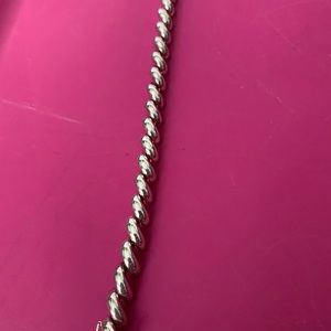 Silver s or rope puff bracelet. Never worn